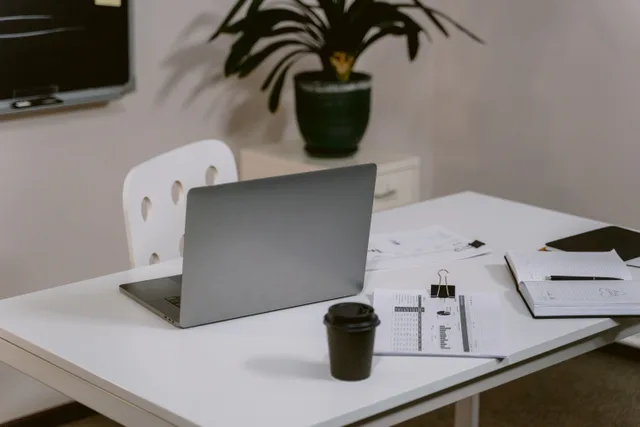 A clean and organized office desk with a laptop and business documents, ideal for productivity. Which markets suit a translation agency business for 2027