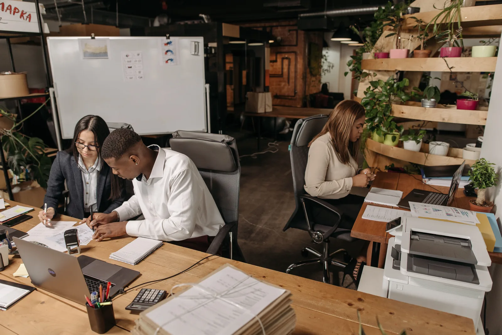 Teamwork in a modern office with diverse colleagues working together on documents. Local SEO for translation agencies: the checklist that holds up