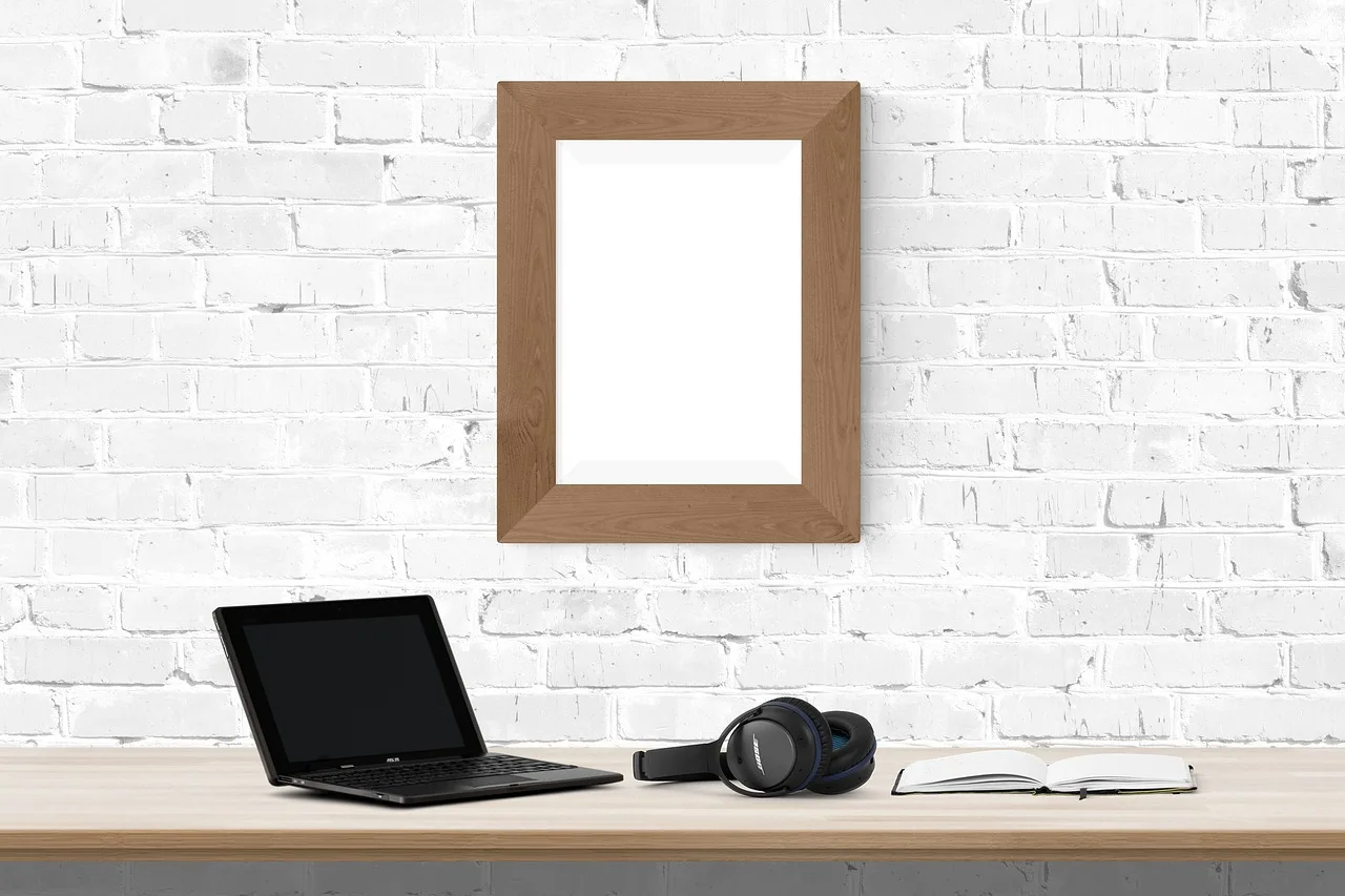 poster, frame, desk, laptop, book, headphone. Remote translation teams across Canadian time zones, a winter operations guide