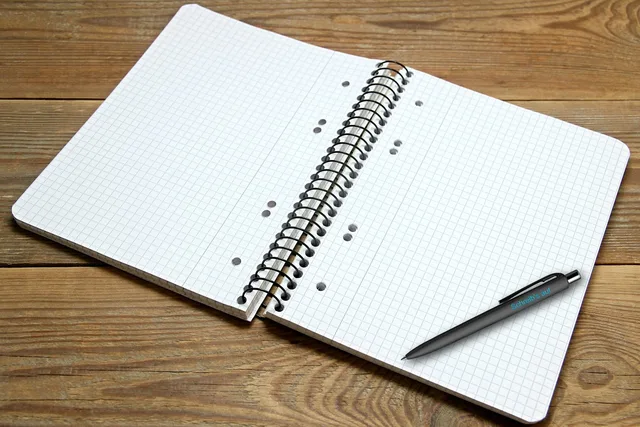 a book, writing pad, notepad, checkered, ballpoint pen, write, table, paper, news, diary, decoration, ink pen, note, words, notes. Certification for translators compared across Ontario, Quebec and British Columbia